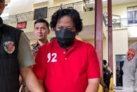 1765602403377-bos-terra-drone-michael-wishnu-wardhana-berbaju-tahanan-usai-ditetapkan-jadi-tersangka-kebakaran-maut-1765526648013_169